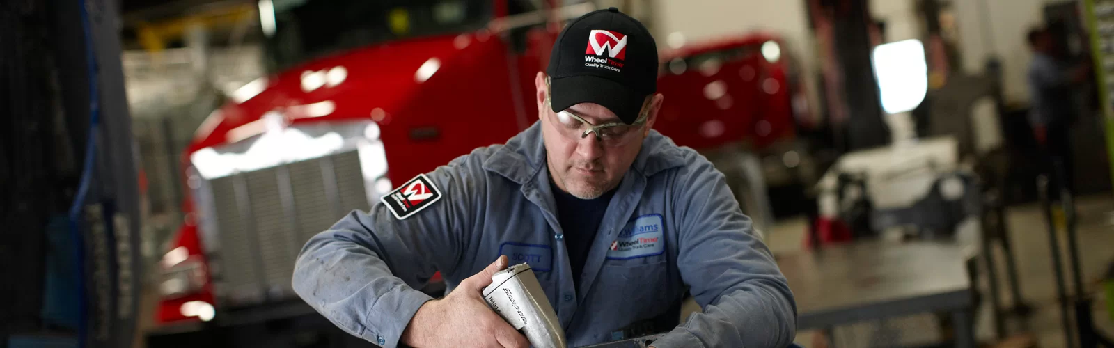 Photo of technician working on engine